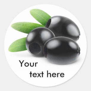 Drie ontpitte zwarte olijven ronde sticker