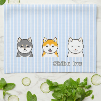 Drie shiba-infuushonden met verschillende kleuren theedoek