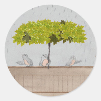 Drie vogels in de regen ronde sticker