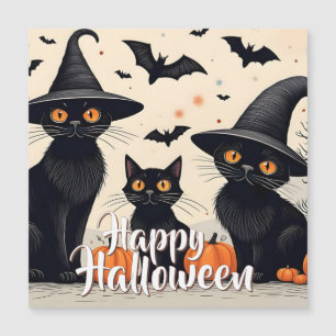 Drie zwarte katten met hoeden op Halloween