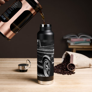 Driverstation voor oude spierklassieke auto met de waterfles