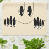 Drôle serviette de cuisine avec yeux jouant (Plié)