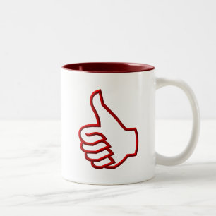 Duim omhoog hand tweekleurige koffiemok