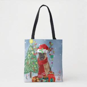 Duitse herderhond met kerstcadeaus in sneeuw draagtas