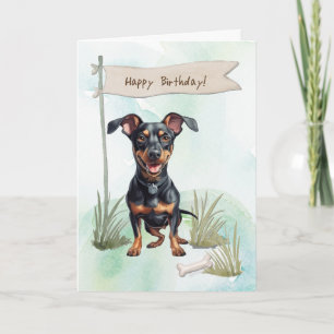 Duitse Pinscher hond buiten onder verjaardagsbord Kaart
