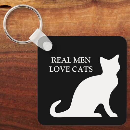 Echte mannen houden van zwarte en witte omkeerbare sleutelhanger (Voorkant)