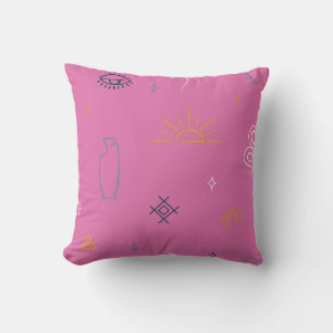 Eclectisch symbolisch patroon op roze kussen