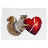 Écureuil avec le grand sac rouge de cadeau de (Dos)