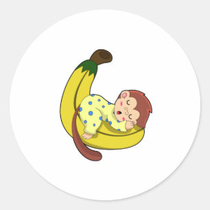 Een aap die slaapt in de pyjama ronde sticker