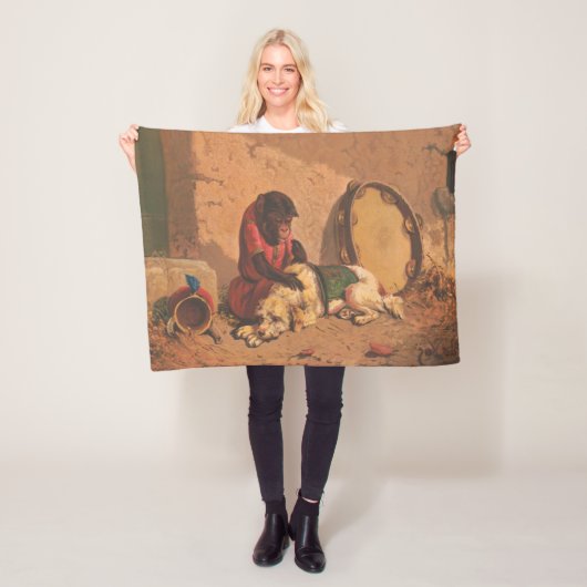 Een aap en een hond met een grote tamboerijn fleece deken (In situ)