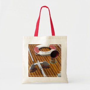 Een anker en een reddingsboei op een houten boot tote bag
