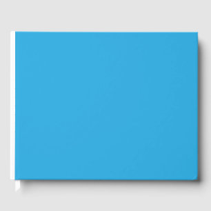 Een blauwe achtergrond met een gastenboek
