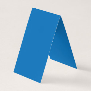 Een blauwe achtergrond met een zwart-witte klok visitekaartjes