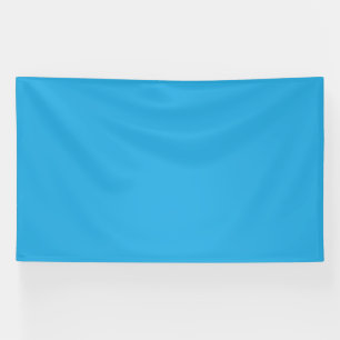 Een blauwe achtergrond met een zwarte en witte kat spandoek
