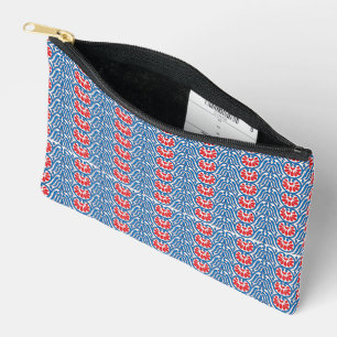 Een blauwe achtergrond met rode en witte design etui