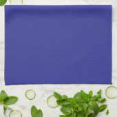 Een blauwe muur met een klok theedoek (Gevouwen)