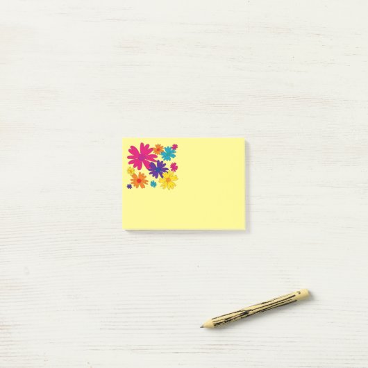 Een bloembed van melkbloemen post-it® notes (Op bureau)