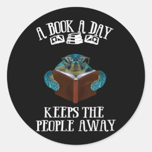 Een boek per dag draaien houdt de mensen weg. ronde sticker