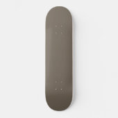 Een bruine muur met een zwart-witte klok erop skateboard (Voorkant)