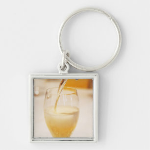 Een champagneglazen flesje gevuld met Gosset Sleutelhanger