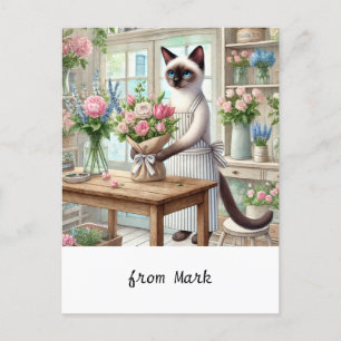 Een charmante kat regelt zorgvuldig mooie bloemen feestdagenkaart