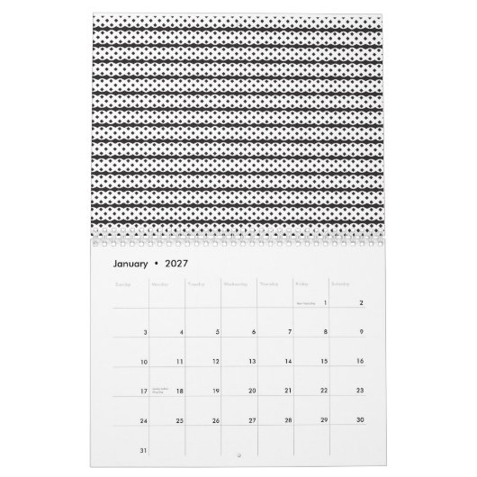 Een close-up van een pluizige oranje en witte kat kalender (Jan 2027)
