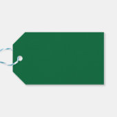 Een diepgroene achtergrond contrasteert met een kn cadeaulabel (Achterkant Horizontaal)