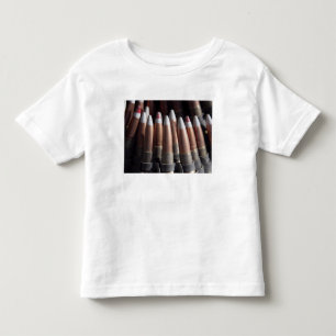 Een even mengeling van vier kogelronden aan één kinder shirts