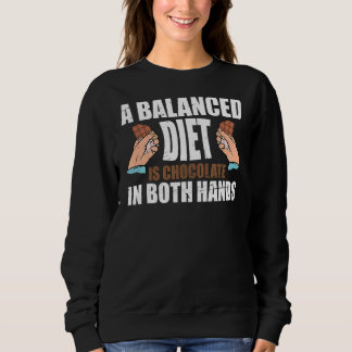 Een evenwichtig dieet is chocolade in beide handen trui
