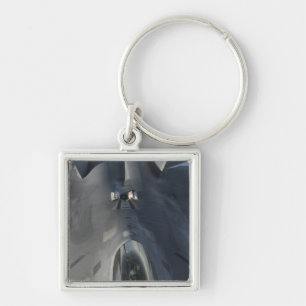 Een F-22 Raptor beweegt zich in positie om f te on Sleutelhanger