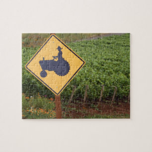 Een gele bord dat een tractorwaarschuwing aangeeft legpuzzel