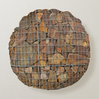 een grijze baksteenwandtextuur als achtergrondabst rond kussen