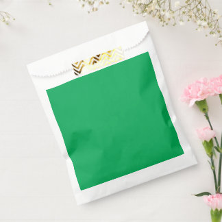 Een groene achtergrond met een bedankzakje
