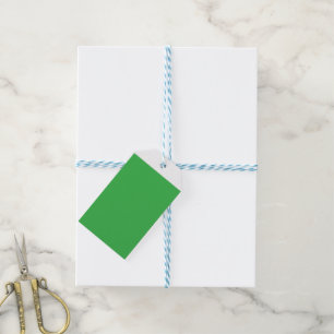 Een groene achtergrond met een witte rand cadeaulabel