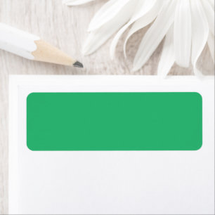 Een groene achtergrond met een witte rand etiket