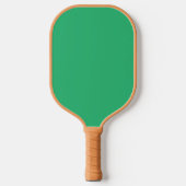 Een groene achtergrond met een witte rand pickleball paddle (Voorkant)