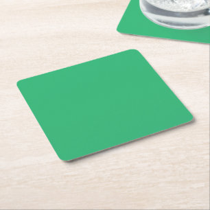 Een groene achtergrond met een witte rand vierkante kartonnen onderzetter