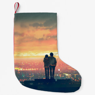 een jong koppel dat boven op het dak staat , kijkt kleine kerstsok