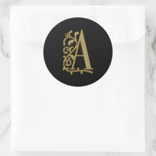 Een krullend monogram op zwart ronde sticker