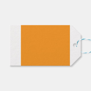 Een levendig oranje plein omgeven door een witte r cadeaulabel