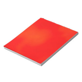 Een levendig rood notitieboek met een subtiele notitieblok