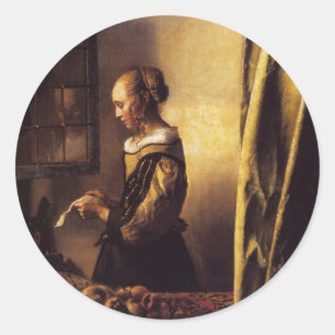 Een meisje dat een brief in een open venster leest ronde sticker