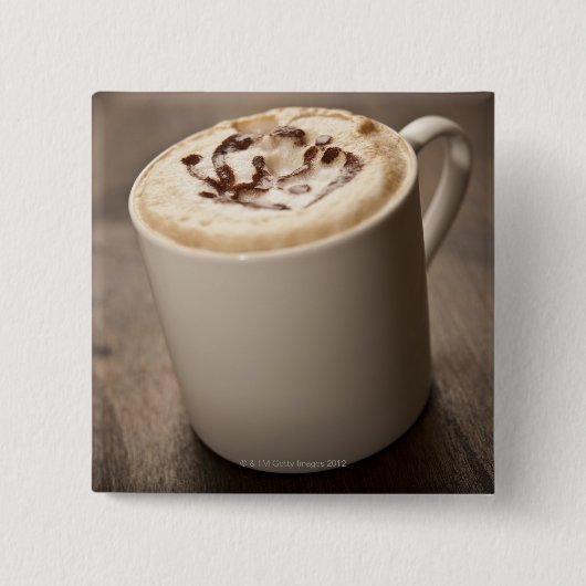 Een mok met gesmolten koffie van Cappucino Vierkante Button 5,1 Cm (Voorkant)