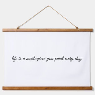 Een muurschildertje met bovenzijde hangend wandkleed