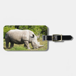 Een neushoorn zien eten tijdens een safari bagagelabel