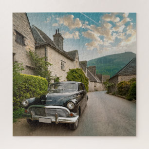 Een oldtimer geparkeerd in een schilderachtig dorp legpuzzel