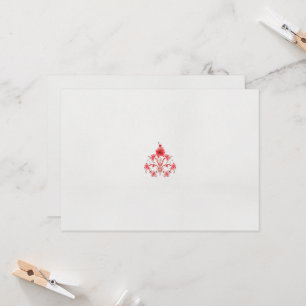 Een ontwerp van een rode bloem op een witte achter kaart