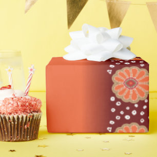 Een ontwerp van een rood en goud patroon cadeaupapier