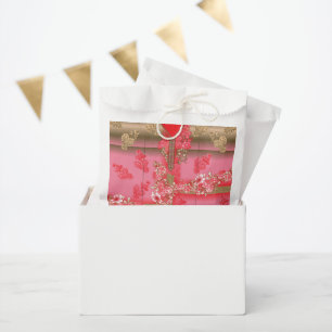 Een ontwerp van een roze en gouden achtergrond met bedankzakje