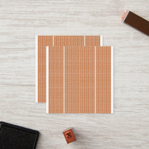 Een oranje en witte gestreepte achtergrond met kle klantenkaartje
